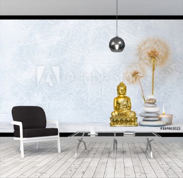 Picture of Buddha pyramid of pebbles burning candle and dandelion flowers as zen background